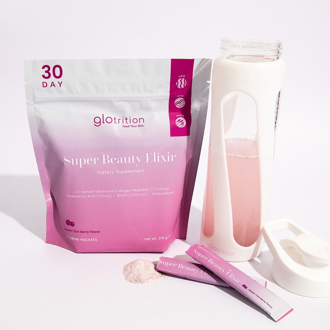 Glotrition Super Beauty Elixir 30-day collagen drink mix packet displayed with a water bottle filled with the pink berry beauty drink and stick packs in front.
