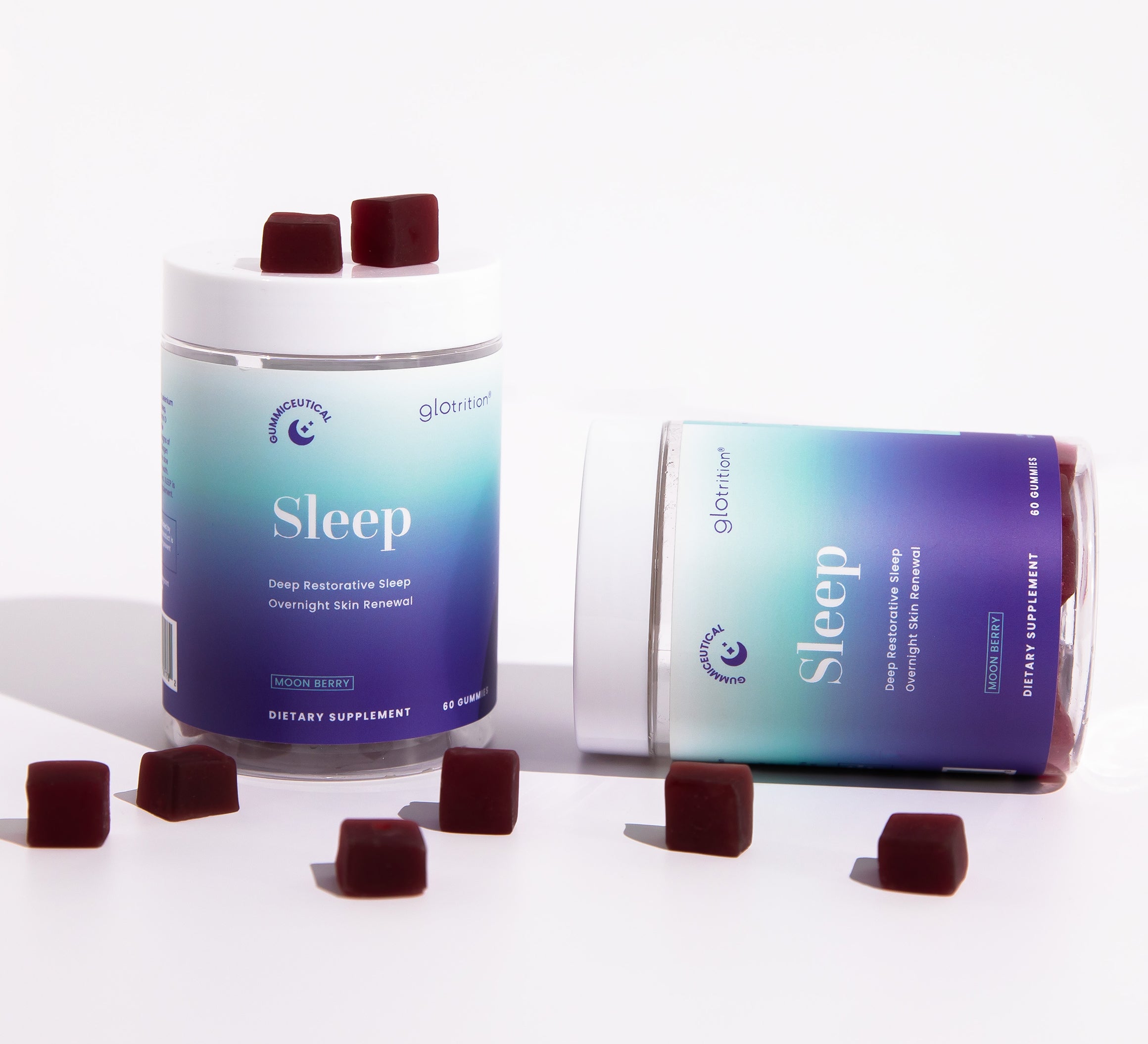 Two Glotrition Sleep jars with moon berry gummies displayed around them—supporting deep restorative sleep and overnight skin renewal.