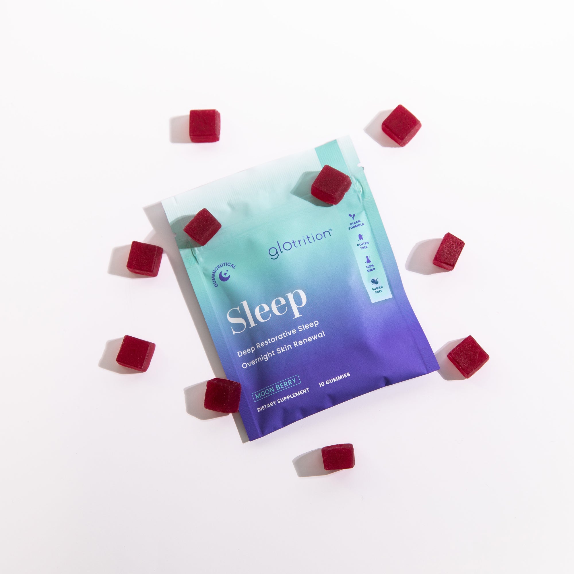 A Sleep Travel Pack by Glotrition, featuring a Proprietary MCS Blend, with five small red tablets scattered around the packaging.