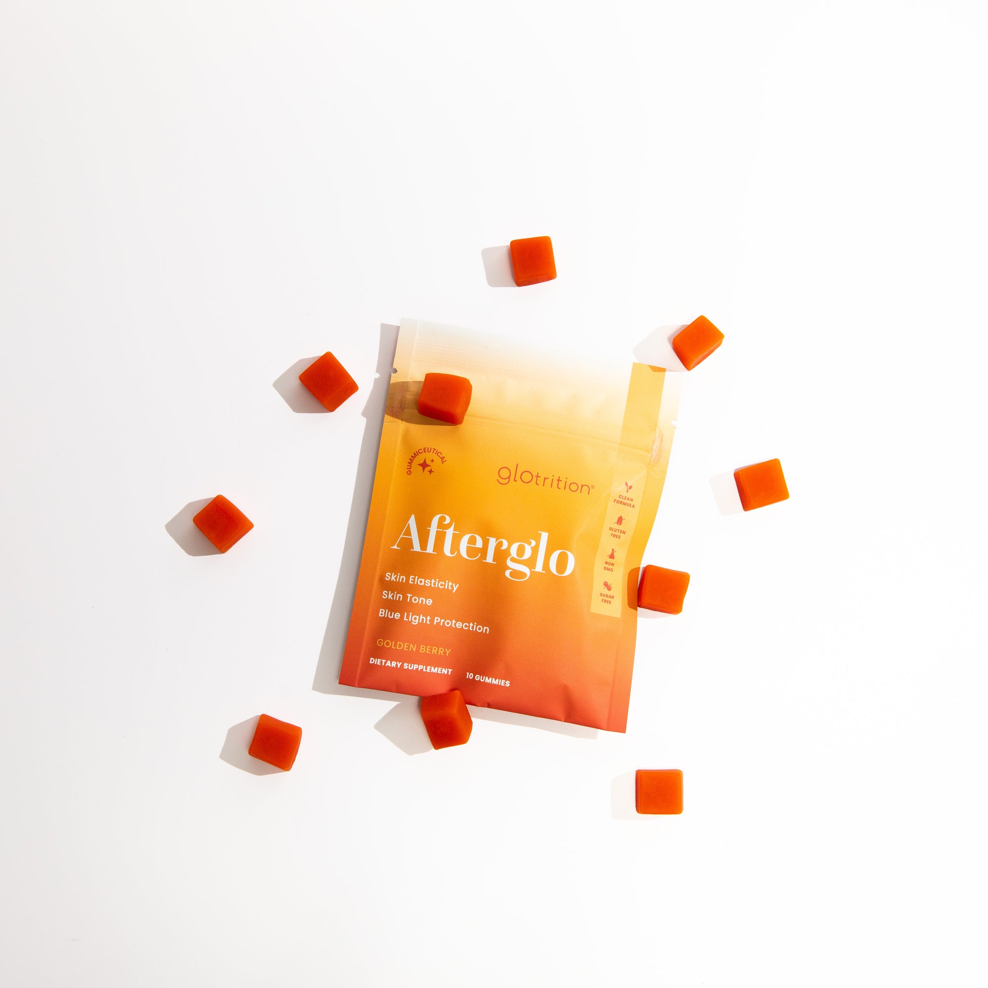 Afterglo supplement package with scattered orange capsules on a white background