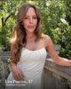 Founder Lisa in white dress outside